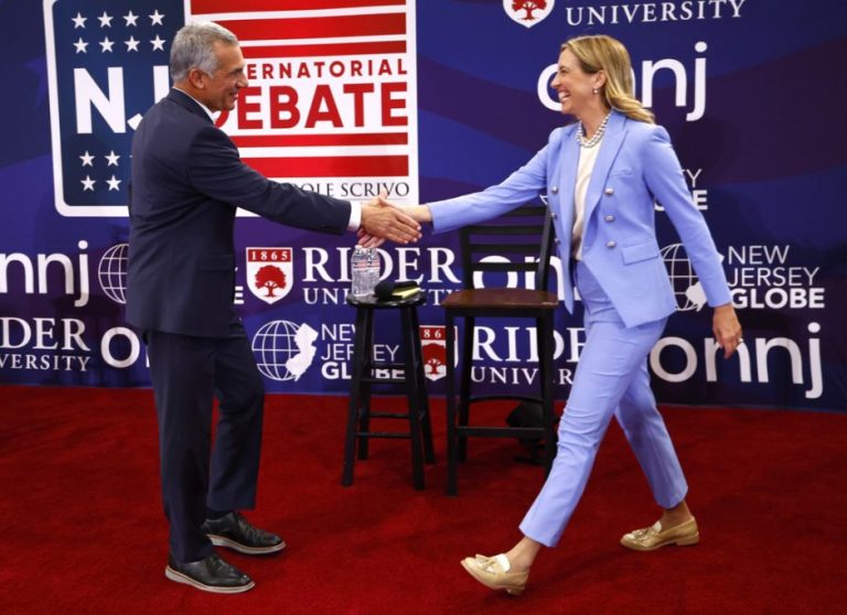 Jack Ciattarelli and Mikie Sherrill shake hands during opening debate of New Jersey's 2025 gubernatorial race.