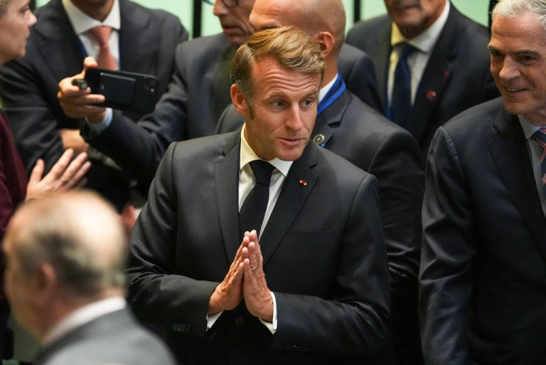 French President Emmanuel Macron arrives inside the United Nations General Assembly Hall.