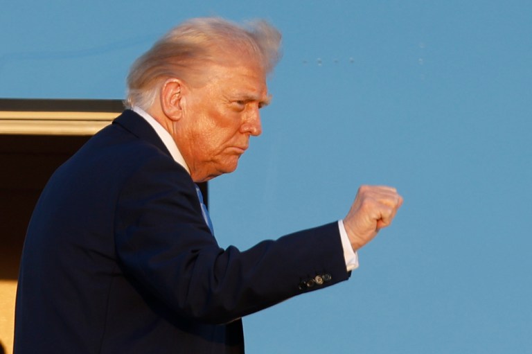 President Donald Trump gestures from the stairs of Air Force One upon his arrival at Joint Base Andrews, Md., Monday, Sept. 22, 2025.