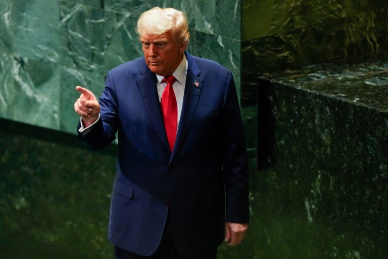President Donald Trump motions as he leaves after addressing the 80th session of the United Nations General Assembly.