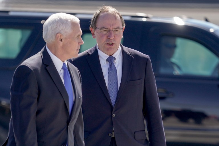 Vice President Mike Pence talks to Tom Tiffany at the airport after visiting the GE Healthcare manufacturing facility April 21, 2020, in Madison, Wisconsin.