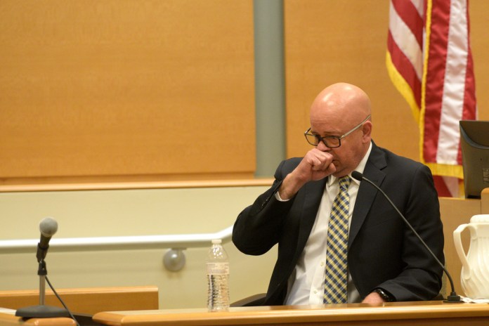 FBI agent William Aldenberg tries to compose himself while testifying during the first day of Alex Jones' Sandy Hook defamation damages trial at Waterbury Superior Court, Sept. 13, 2022, in Waterbury, Conn. (H John Voorhees III/Hearst Connecticut Media via AP, File)