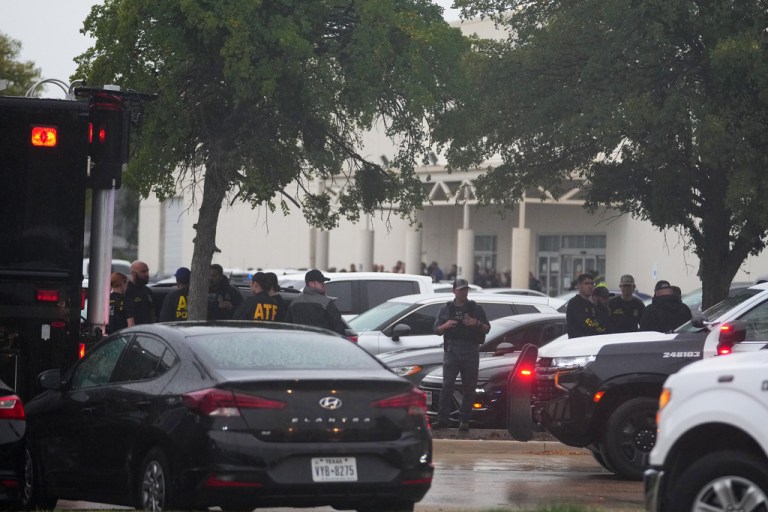 Law enforcement gather at a staging area close to a U.S. Immigration and Customs Enforcement office after a reported shooting, in Dallas on Wednesday, Sept. 24, 2025.
