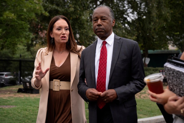 Agriculture Secretary Brooke Rollins, left, and Ben Carson speak with reporters outside the White House, Wednesday, Sept. 24, 2025, in Washington. (AP Photo/Mark Schiefelbein)