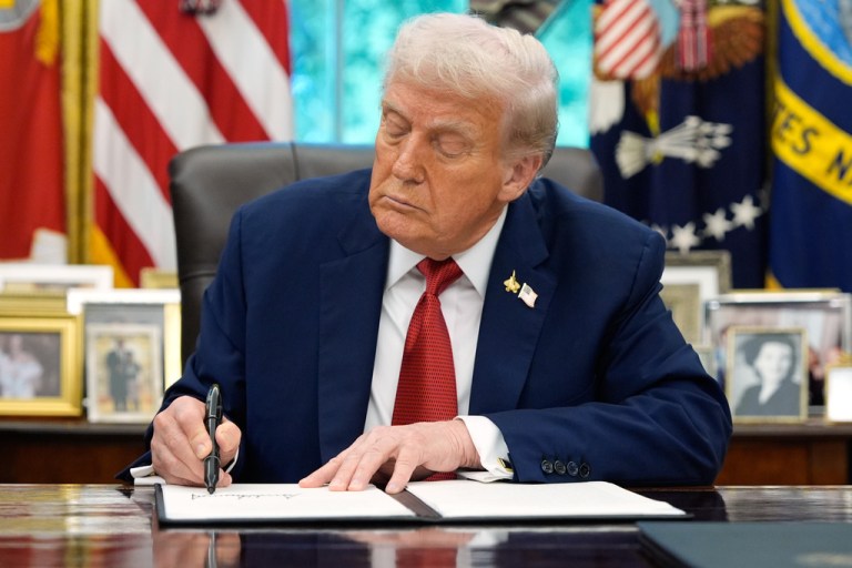 President Donald Trump signs an executive order regarding TikTok in the Oval Office at the White House, Thursday, Sept. 25, 2025, in Washington.