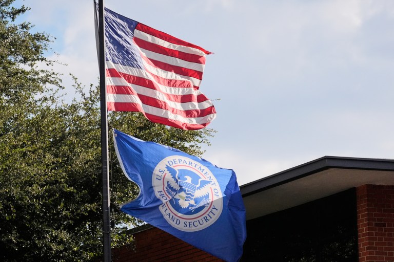 The U.S. and Department of Homeland Security flags.