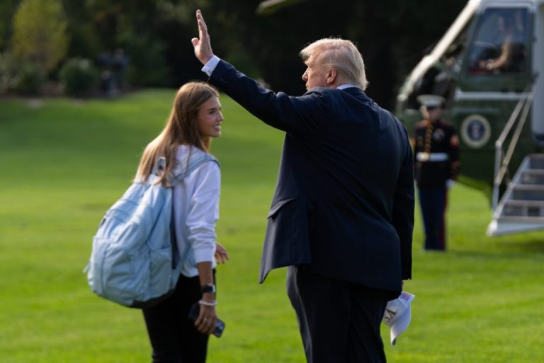 President Donald Trump and his granddaughter, Kai Trump, walk to board Marine One on the South Lawn of the White House.