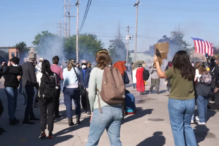 Anti-ICE protesters are walking outside ICE detention facility in Broadview, Illinois.