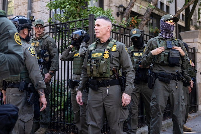 Greg Bovino, the chief patrol agent for the U.S. Border Patrol El Centro sector, stands with federal immigration agents on North Clark Street near West Oak Street in River North, Sunday, Sept. 28, 2025, in Chicago (Ashlee Rezin/Chicago Sun-Times via AP)