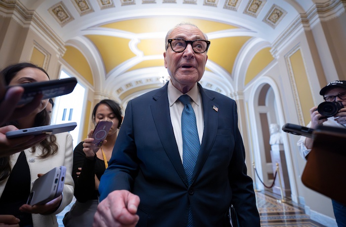 Senate Minority Leader Chuck Schumer, D-N.Y., talks to reporters as he departs for a meeting with President Donald Trump and the top four congressional leaders to discuss the government funding crisis, at the Capitol in Washington, Monday, Sept. 29, 2025