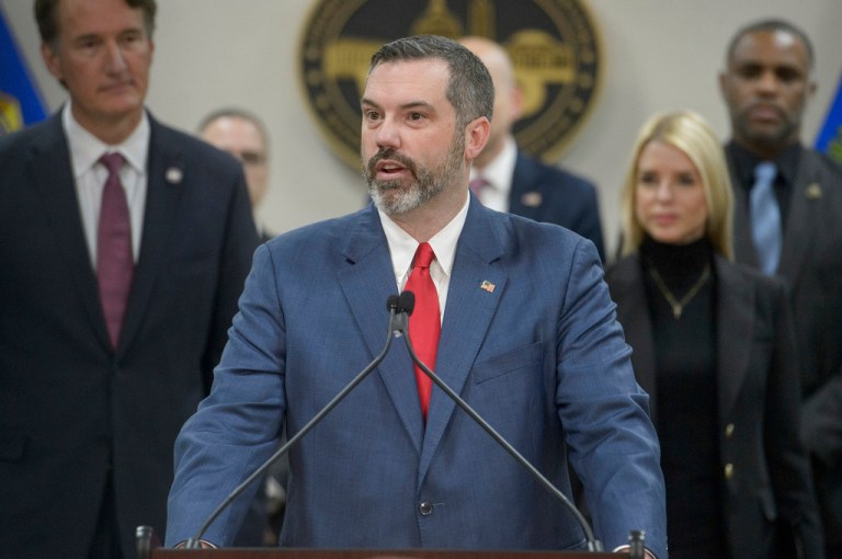 Erik Siebert, interim U.S. Attorney for the eastern district of Virginia, speaks as Attorney General Pam Bondi and Virginia Gov. Glenn Youngkin listen during a news conference.