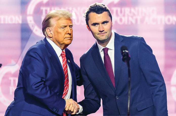 Charlie Kirk shakes hands with President Donald Trump in Phoenix, Dec. 22, 2024. (Josh Edelson/AFP/Getty)