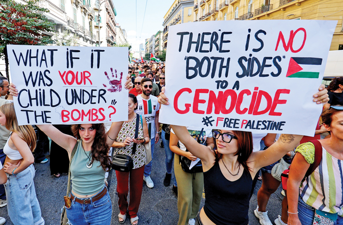 A sign in an anti-Israeli demonstration in Naples, Italy, adopting Hamas’s language of ‘genocide’ against Palestinians, Sept. 22, 2025. (Marco Cantile/LightRocket/Getty)