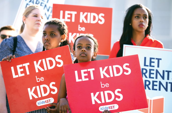 Demonstrators are seen outside the Supreme Court as oral arguments are heard in Mahmoud v. Taylor on Tuesday, April 22, 2025. (Tom Williams/CQ-Roll Call, Inc/Getty Images)