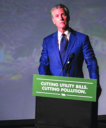 California Gov. Gavin Newsom hosts a press conference and signs a slew of climate initiative bills at the Academy of Sciences on Friday, Sept. 19, 2025 in San Francisco. (AP Photo/Camille Cohen)