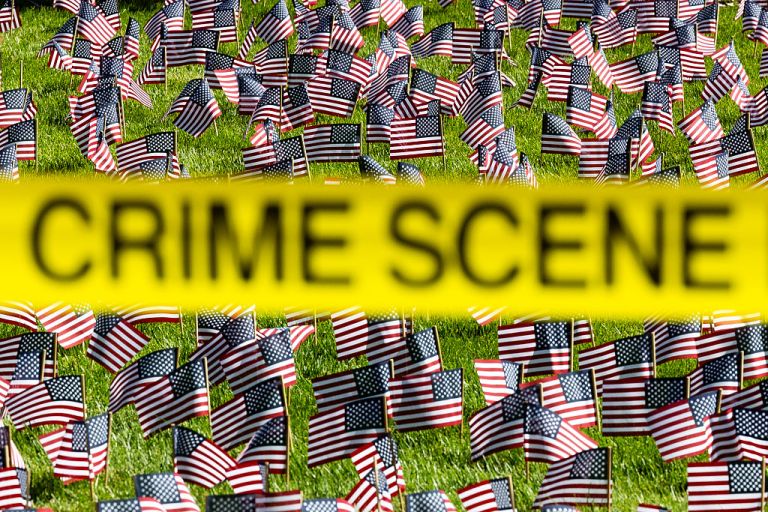 Crime scene tape flies in front of a 9/11 memorial following the fatal shooting of political activist Charlie Kirk during an event at Utah Valley University on September 11, 2025 in Orem, Utah. Authorities have released a 