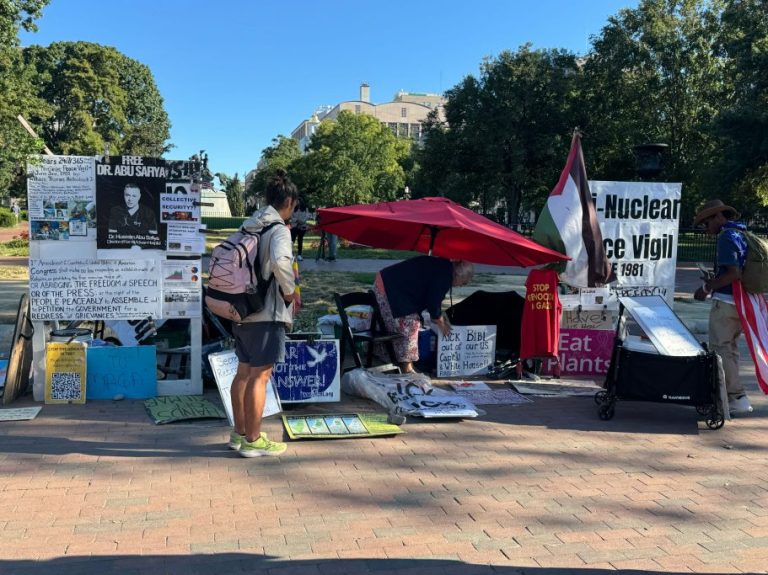 An anti-war peace vigil remains opposite the White House.