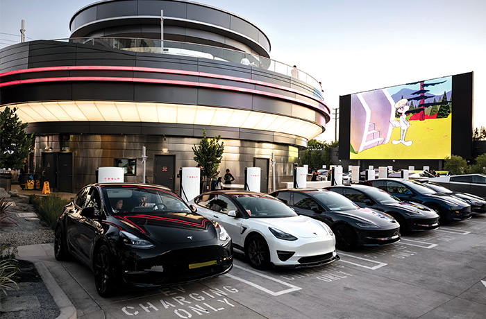 Teslas owners charge up, order hamburgers and hot dogs, and watch movies all at the same time at the Tesla Diner in West Hollywood on July 29. (David Crane/MediaNews Group/Los Angeles Daily News via Getty Images)