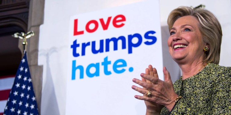 Hillary Clinton claps.