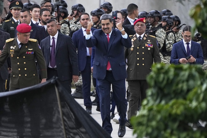 President Nicolas Maduro gestures to supporters.