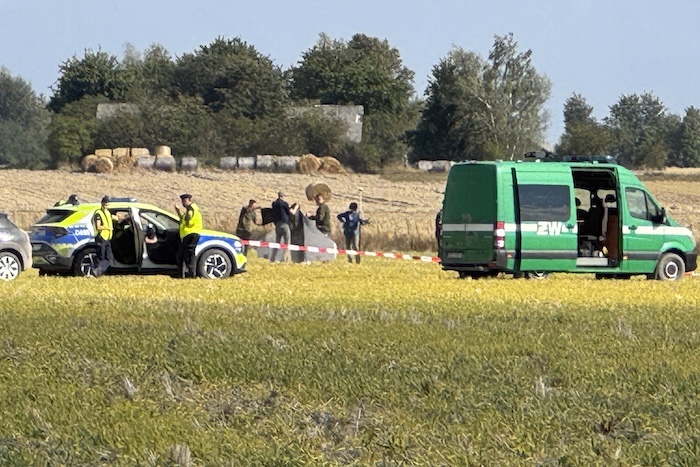 Police and Military Police secure parts of a damaged UAV shot down by Polish authorities.