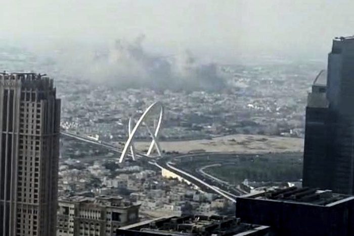 Smoke rises from an explosion.