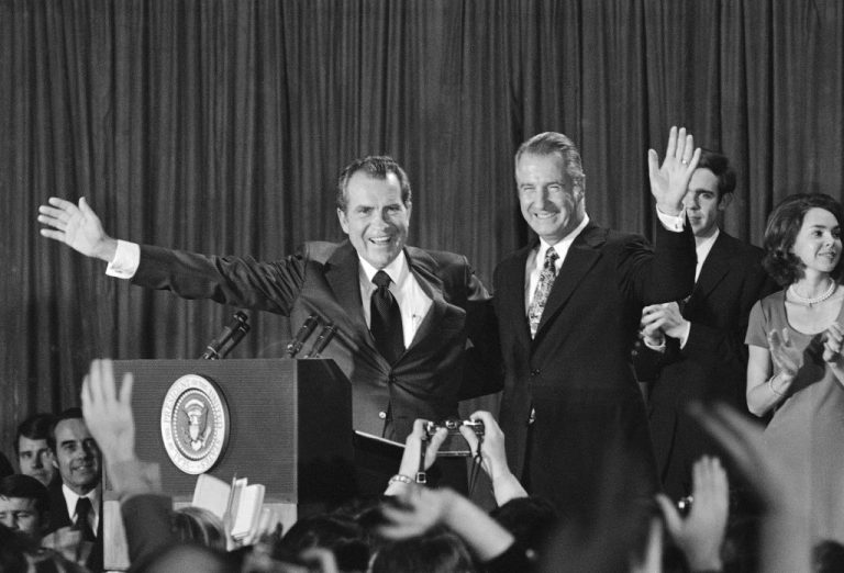 President Richard Nixon and Vice President Spiro Agnew wave to a cheering crowd.