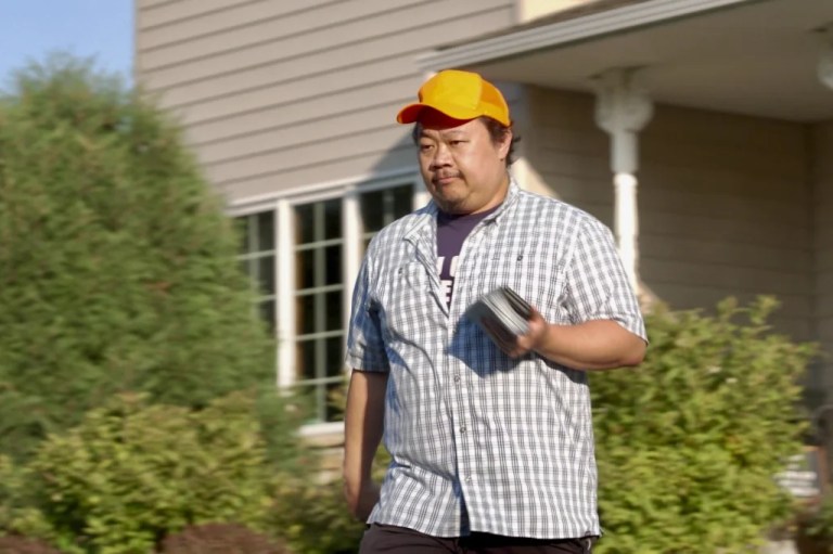 Xp Lee, Democratic candidate for Minnesota house district 34B, knocks on doors during campaigning in Brooklyn Park, Minn., Thursday, Sept. 11, 2025. (AP Photo/Mark Vancleave)