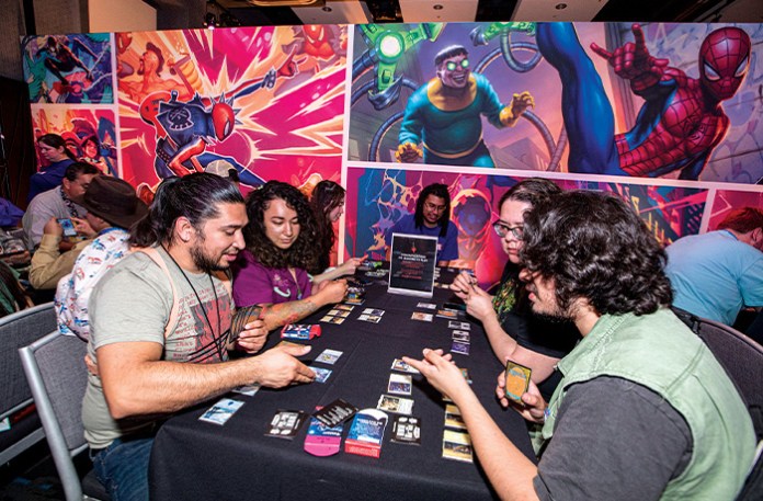 Attendees learn how to play Magic: The Gathering card game during 2025 Comic-Con International on July 24 in San Diego. (DANIEL KNIGHTON/GETTY IMAGES)
