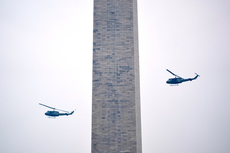 U.S. Army UH-60M Black Hawk helicopters perform a flyover
