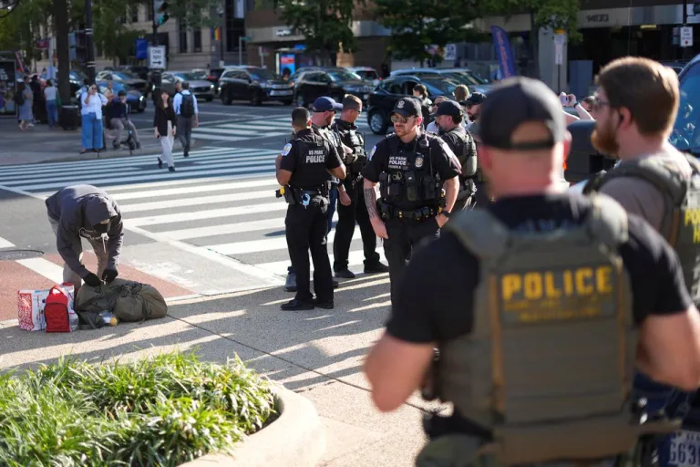 police officers standing near a city street