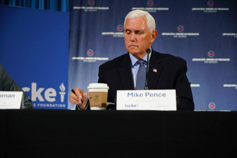 Former Vice President Mike Pence takes notes during a panel discussion on tariffs in Raleigh, N.C., on Monday, May 19, 2025.