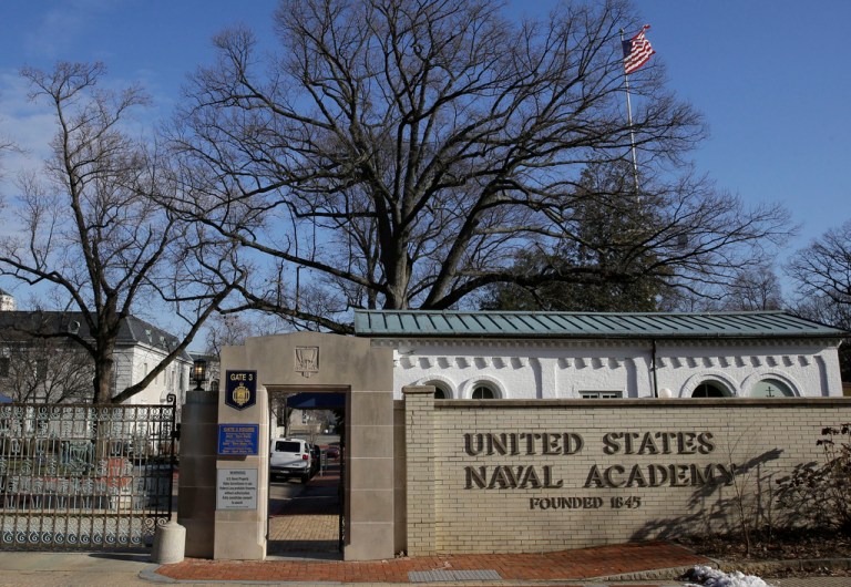 FILE - A sign at entrance to the U.S. Naval Academy campus in Annapolis, Md., Jan. 9,2014.