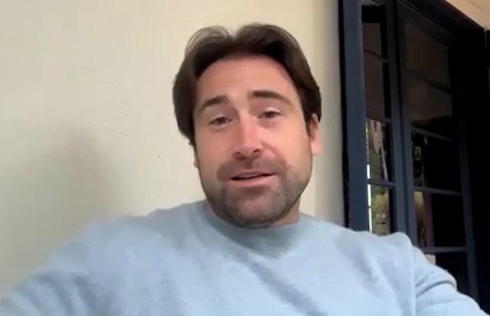 Sean Stone sitting outside