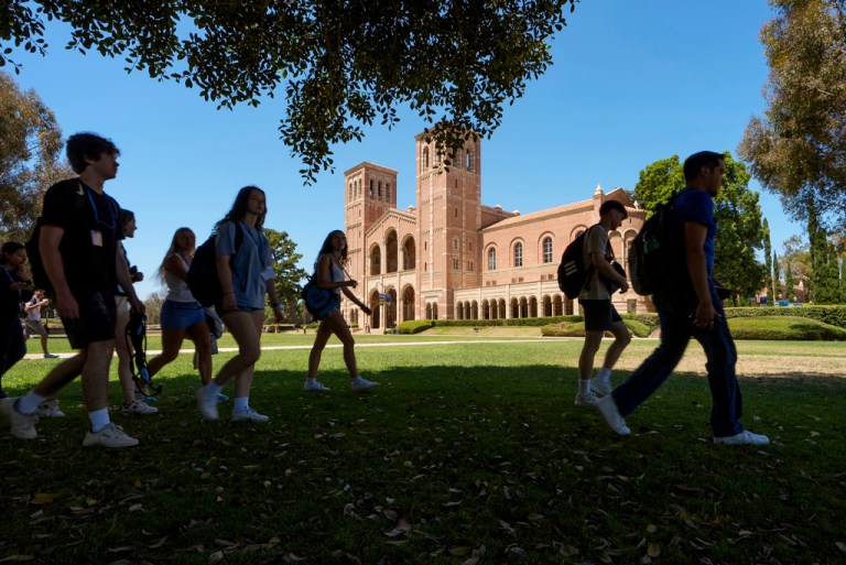 Students walk past Royce Hall on the University of California, Los Angeles, campus in Los Angeles.