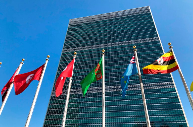 Flags fly outside the United Nations headquarters.
