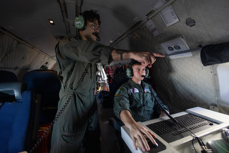 Missions System operator AET3 Caleb McLarty and AET-2 John Montalvo- Valentin onboard a HC-144A Maritime Patrol Aircraft, use radar and other technologies to detect illegal fishing activities off the coast of Padre Island Texas.