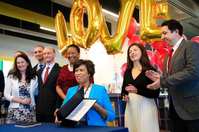 D.C. Mayor Muriel Bowser signs the first LOVE Act in January 2019.