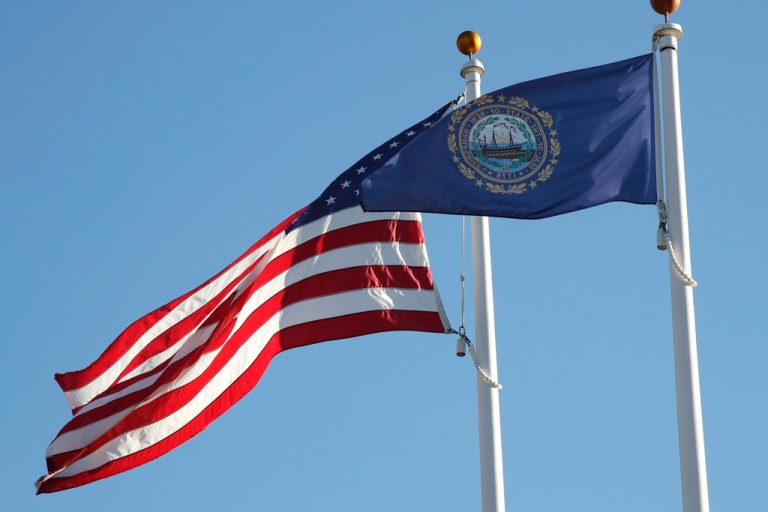 The state flag of New Hampshire flies alongside the American flag, Oct. 4, 2019, in Exeter, N.H. New Hampshire is set to vote for 2024 presidential nominees in the nation's first primary on Tuesday, Jan. 23,2024.