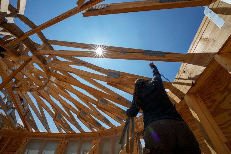 Workers build a home on Sept. 19, 2023, in Marshall, N.C.