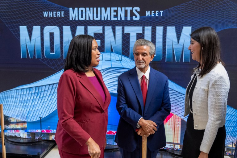 District of Columbia Mayor Muriel Bowser, left, Ted Leonsis, owner of the Washington Wizards NBA basketball team and Washington Capitals NHL hockey team, and District of Columbia Councilmember Brooke Pinto chat after an event announcing the start of work on a new Capital One Arena Gallery Place Atrium, Thursday, Dec. 19, 2024, in Washington.