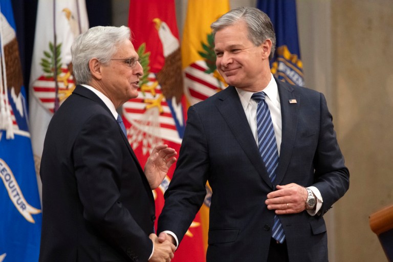 Attorney General Merrick Garland, left, talks with FBI Director Christopher Wray after a farewell ceremony at the Department of Justice, Thursday, Jan. 16, 2025, in Washington.