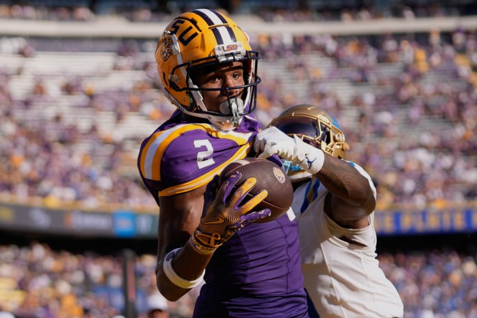 LSU wide receiver Kyren Lacy (2) tries to pull in a pass in the end zone as he is covered by UCLA defensive back Jaylin Davies.
