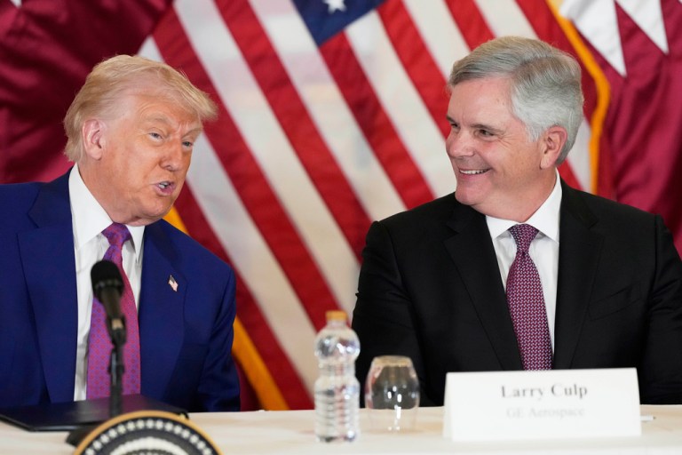 President Donald Trump sits next to GE Aerospace Chairman and CEO Larry Culp.
