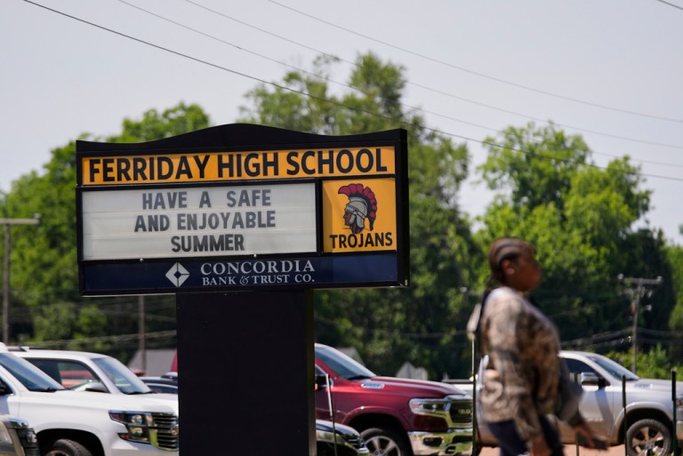 A person walks in front of Ferriday High School in Ferriday, La., Thursday, May 22, 2025.
