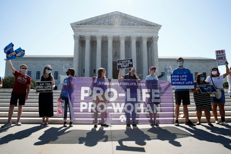 FILE - In this June 29, 2020 file photo, Anti-abortion protesters wait outside the Supreme Court for a decision, in Washington on the Louisiana case, Russo v. June Medical Services LLC. (AP Photo/Patrick Semansky, file)