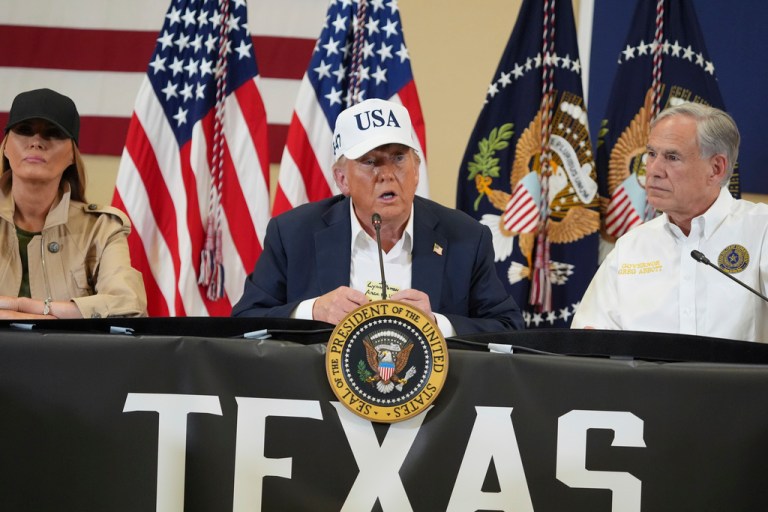 President Donald Trump speaks as first lady Melania Trump, left, and Texas Gov. Greg Abbott listen during a roundtable discussion with first responders and local officials at Hill Country Youth Event Center in Kerrville, Texas, during a tour to observe flood damage, Friday, July 11, 2025.