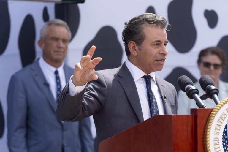 Food and Drug Administration Commissioner Martin Makary speaks as Health & Human Services Secretary Robert F. Kennedy Jr. listens.