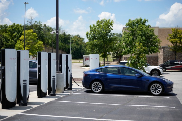 A Tesla electronic vehicle is parked a charging station Tuesday, July 15, 2025, in Nashville, Tenn. (AP Photo/George Walker IV)