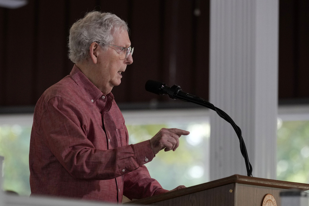 McConnell falls while being questioned by activists